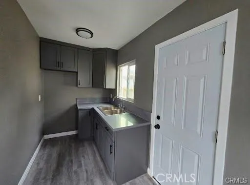 a kitchen with cabinets and stove