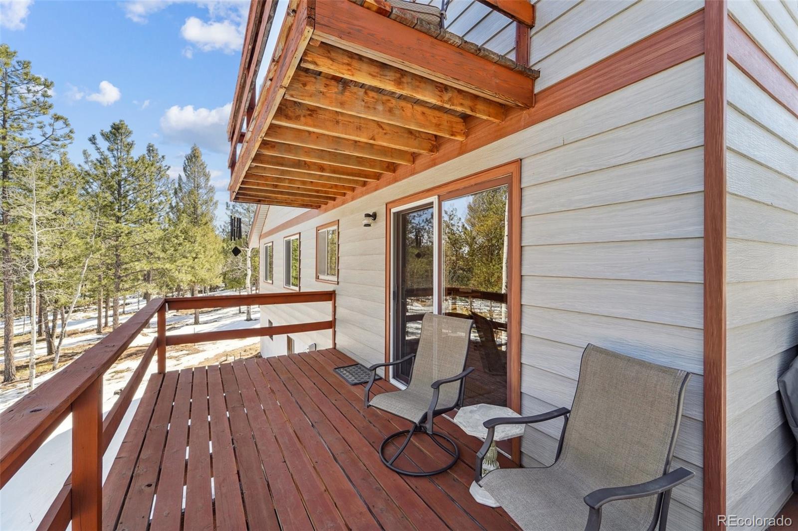 246 Tapadero Road Bailey, CO 80421 - Photo 18 of 50 a view of balcony with wooden floor and outdoor seating