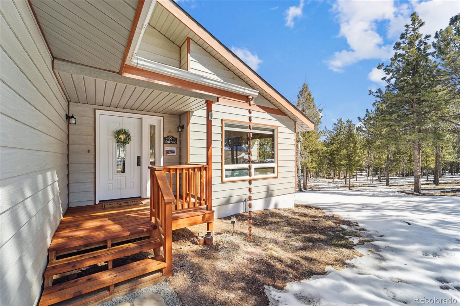 246 Tapadero Road Bailey, CO 80421 - Photo 2 of 50 a backyard of a house with seating space