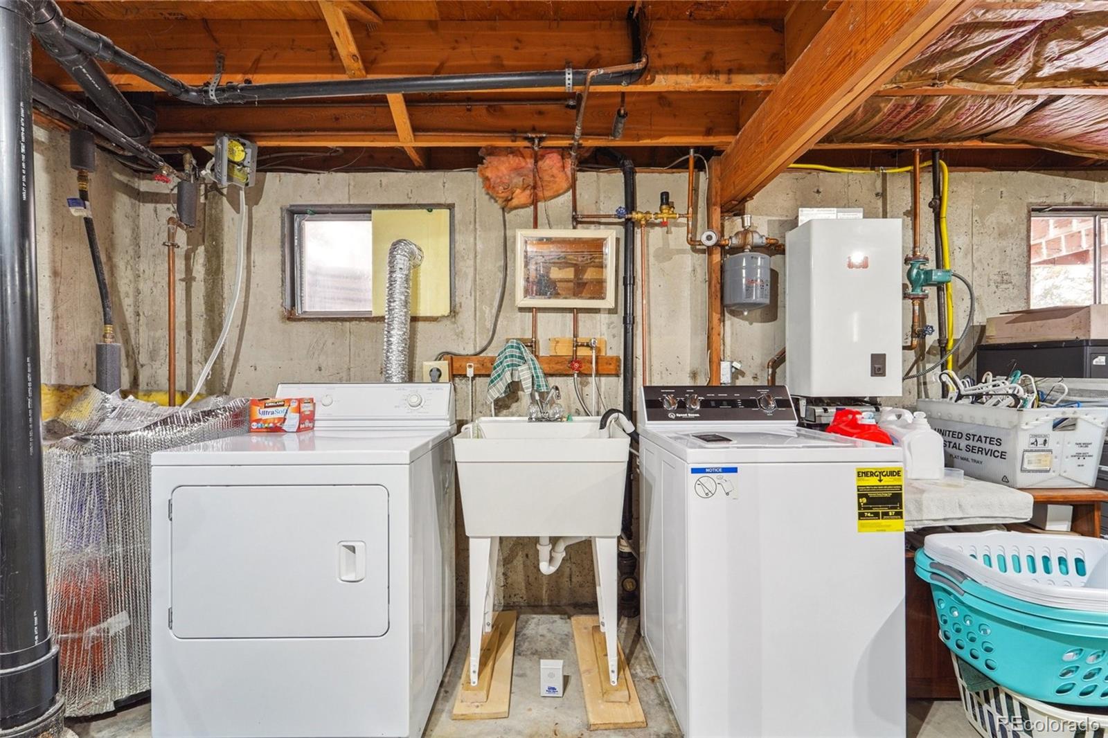 246 Tapadero Road Bailey, CO 80421 - Photo 34 of 50 a utility room with dryer and washer