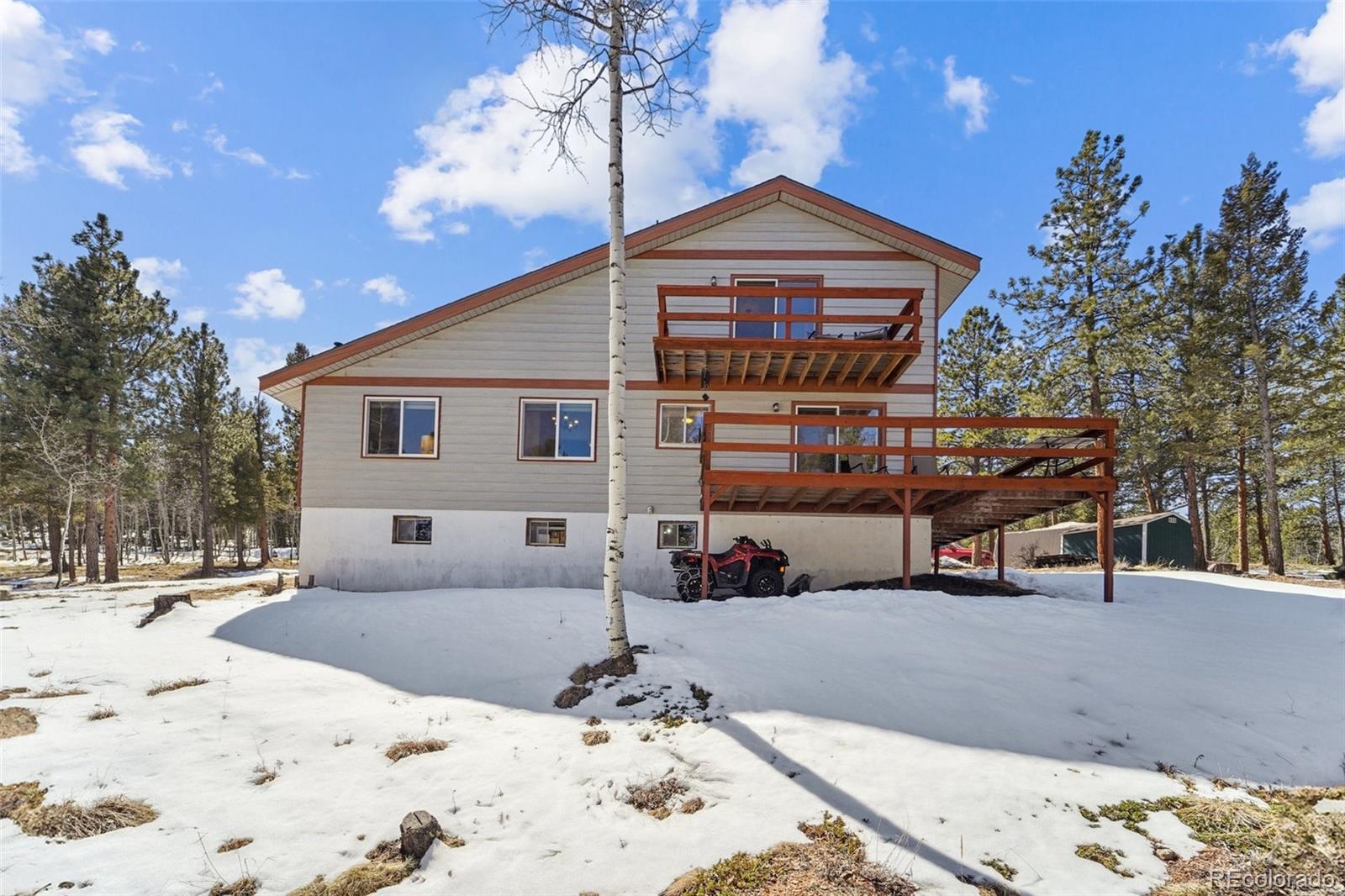 246 Tapadero Road Bailey, CO 80421 - Photo 43 of 50 a view of a house with snow on the road
