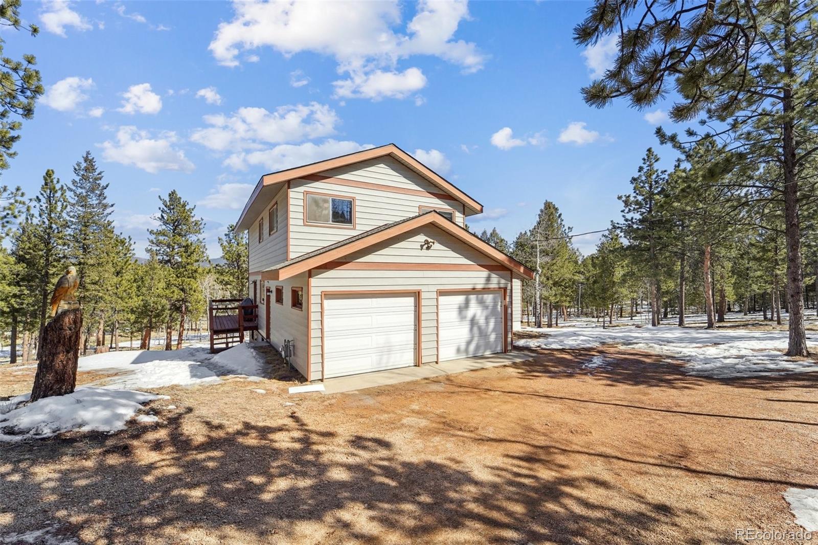 246 Tapadero Road Bailey, CO 80421 - Photo 46 of 50 a front view of a house with a yard