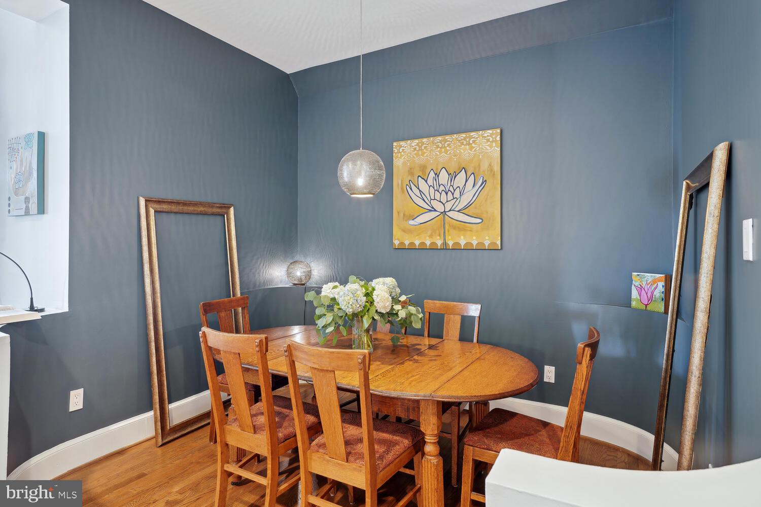 2001 19th Street Northwest, Unit 10 Washington, DC 20009 - Photo 17 of 38 a view of a dining room with furniture and wooden floor
