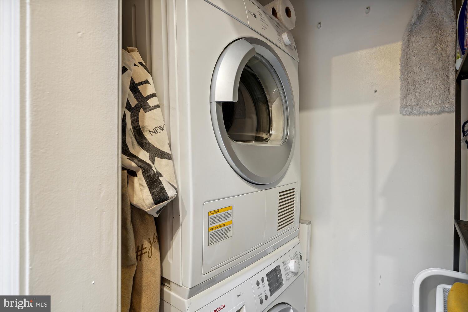 2001 19th Street Northwest, Unit 10 Washington, DC 20009 - Photo 21 of 38 a utility room with dryer and washer