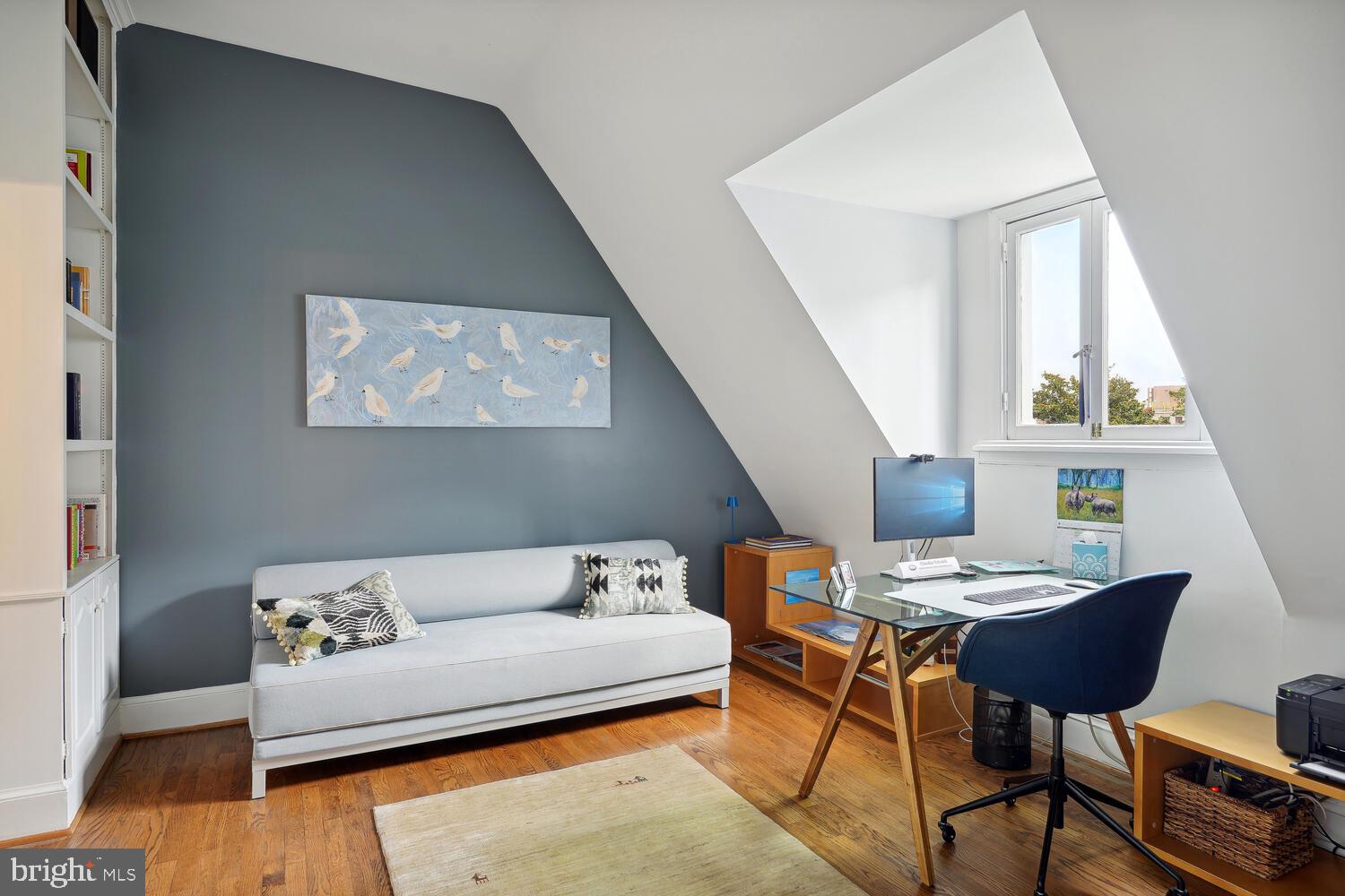 2001 19th Street Northwest, Unit 10 Washington, DC 20009 - Photo 24 of 38 a living room with furniture and a window