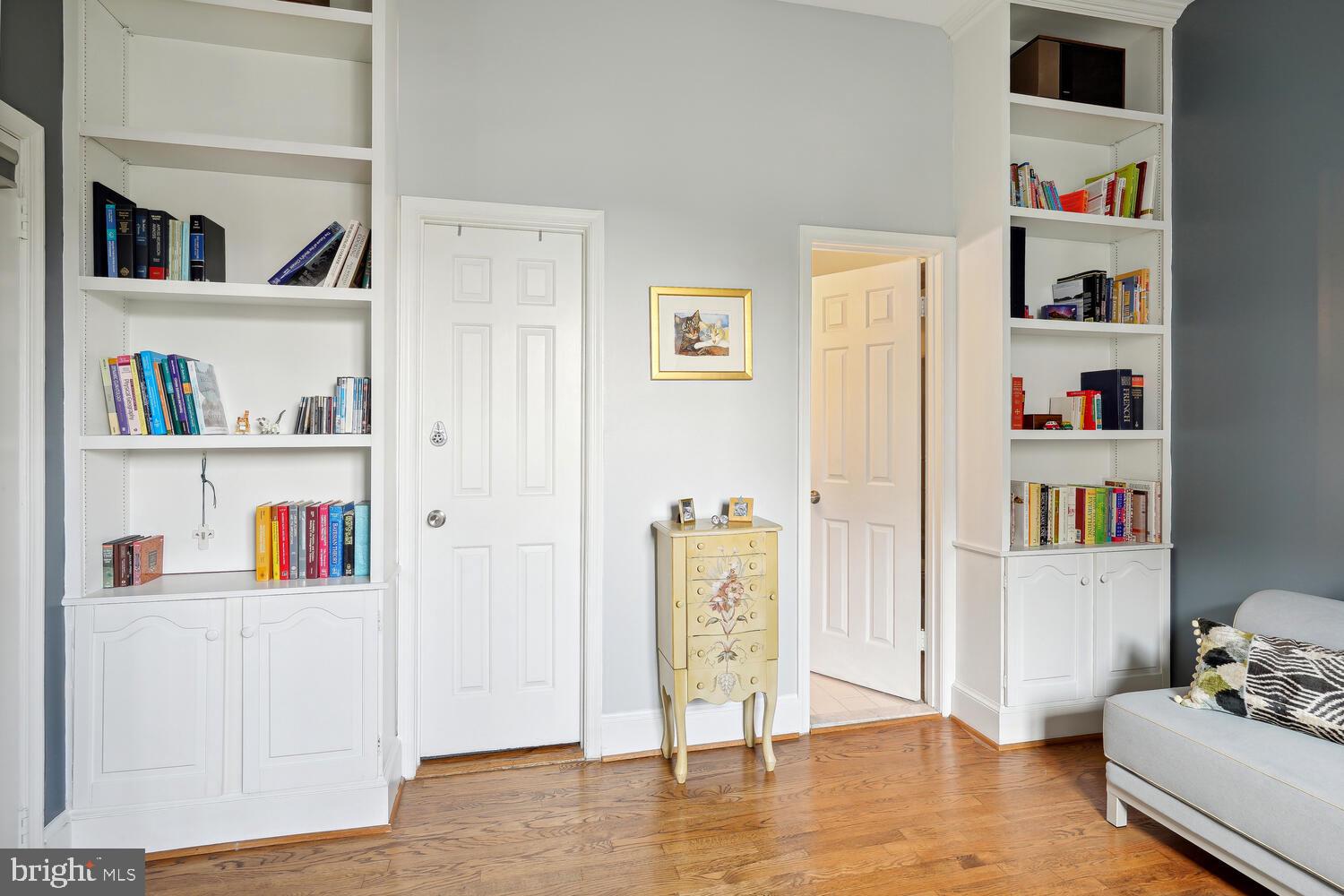 2001 19th Street Northwest, Unit 10 Washington, DC 20009 - Photo 25 of 38 a living room with lots of books and a book shelf