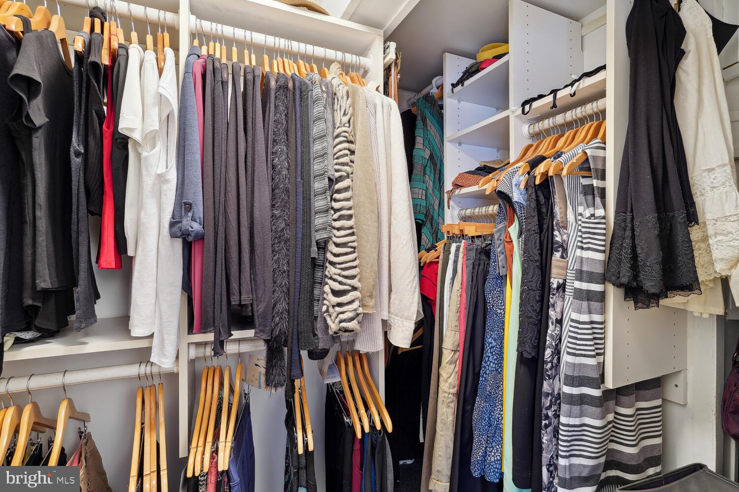 2001 19th Street Northwest, Unit 10 Washington, DC 20009 - Photo 31 of 38 a view of walk in closet with clothes