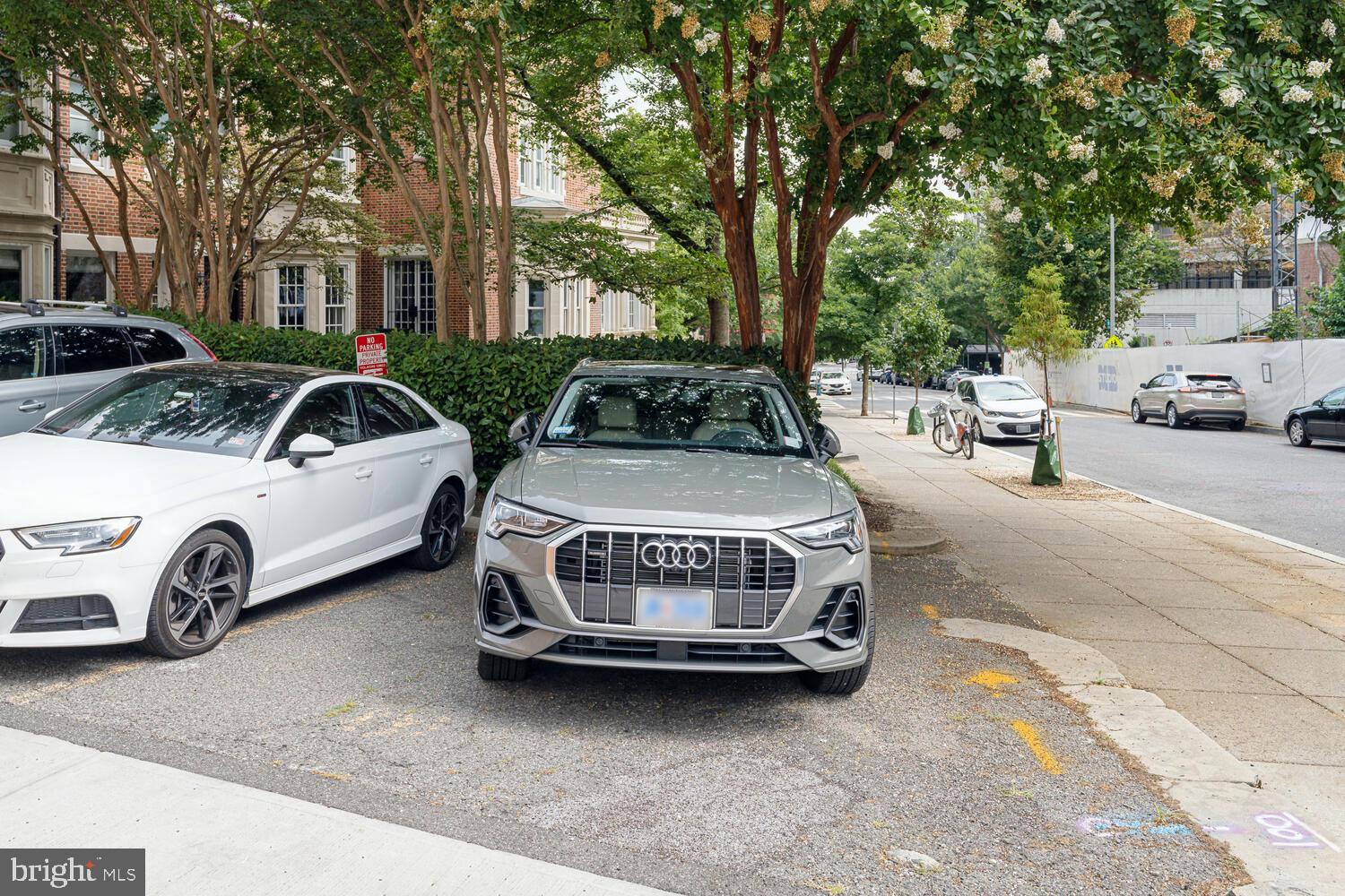 2001 19th Street Northwest, Unit 10 Washington, DC 20009 - Photo 37 of 38 a view of a cars park in front of a house