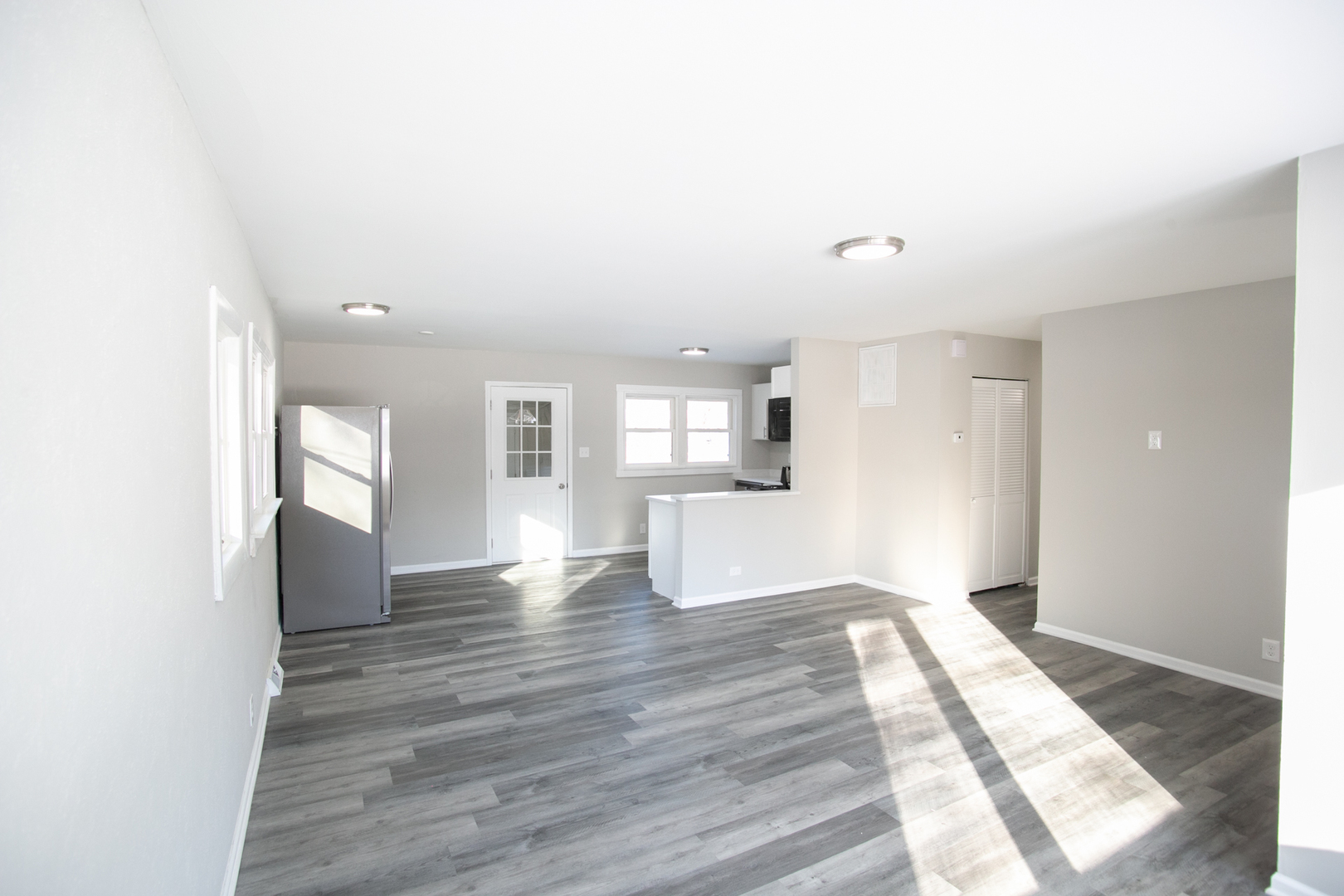 2 Durango Road Montgomery, IL 60538 - Photo 8 of 20 a view of empty room with wooden floor and kitchen