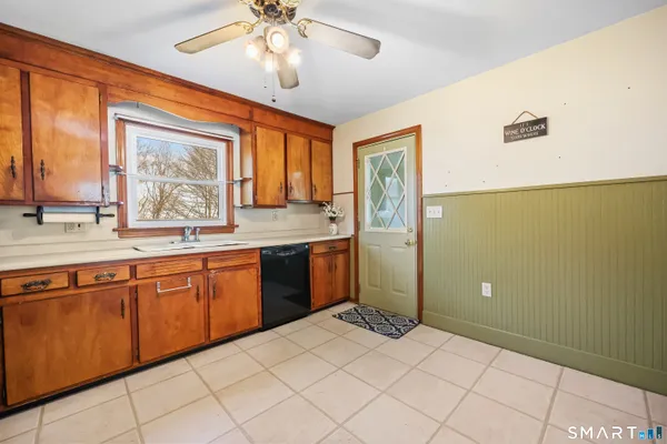 a large kitchen with a window