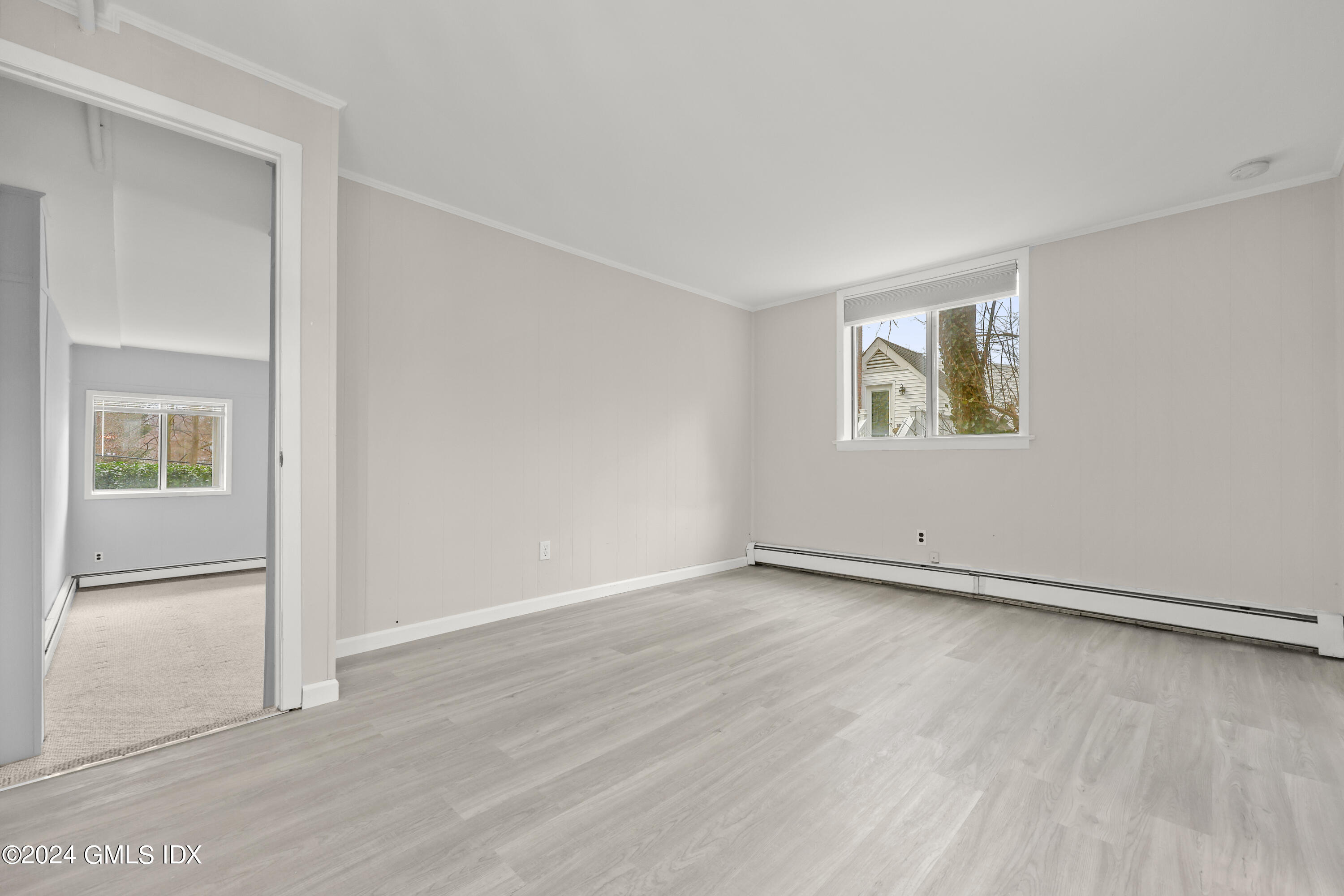 5 Green Lane, Unit A Greenwich, CT 06831 - Photo 21 of 24 an empty room with windows and closet