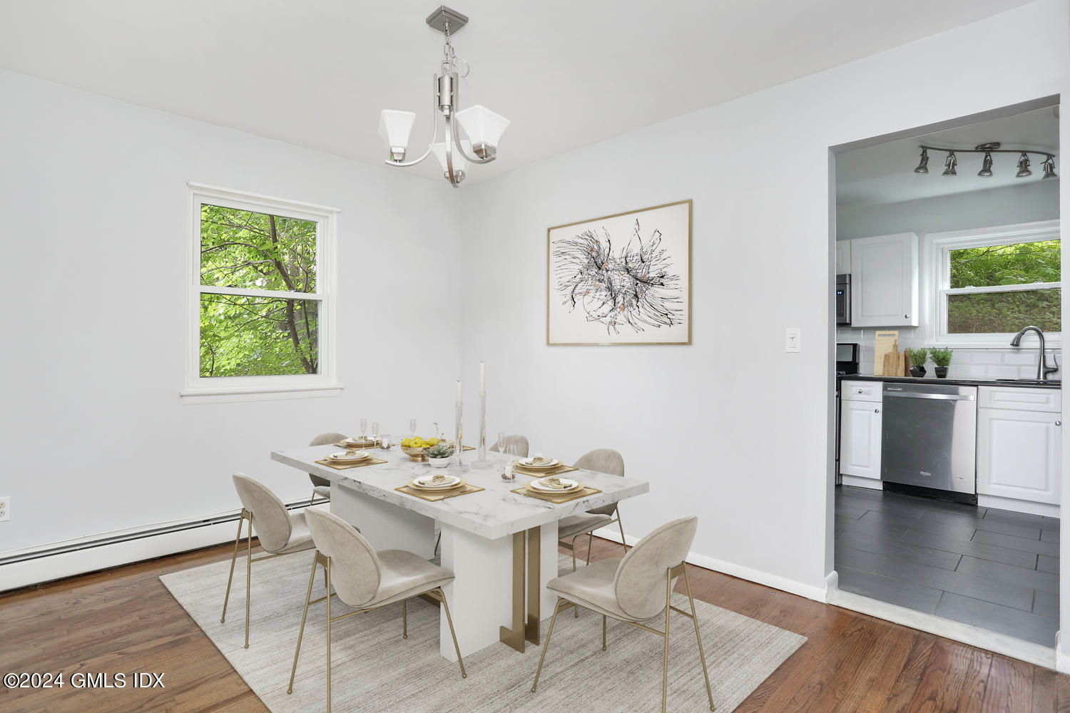 5 Green Lane, Unit A Greenwich, CT 06831 - Photo 3 of 24 a view of a dining room with furniture window and wooden floor