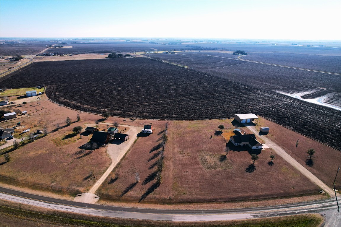 619 Fm 619 Taylor, TX 76574 - Photo 3 of 4 a view of roof and hall with wooden floor