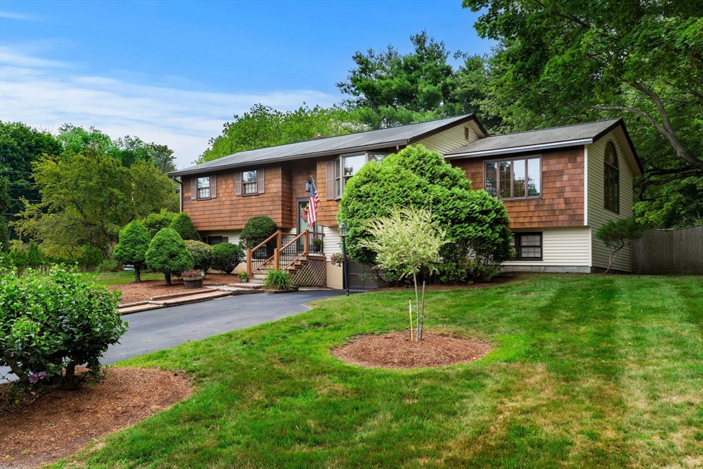 4 Alpha Road Groveland, MA 01834 - Photo 1 of 41 a view of a house with a yard and potted plants