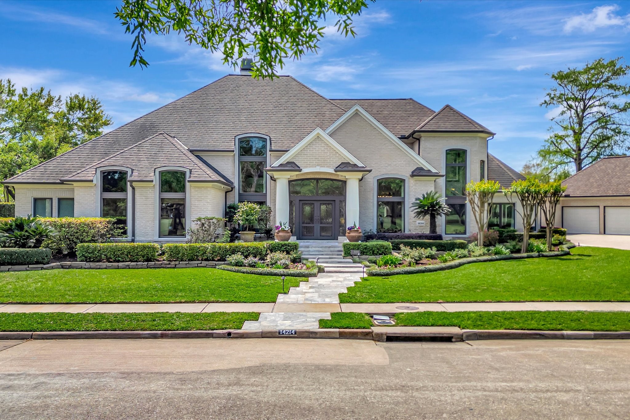 14214 Golf View Trail Houston, TX 77059 - Photo 1 of 49 a front view of a house with a yard table and chairs