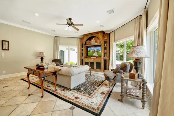 a kitchen with a sink a counter top space cabinets and stainless steel appliances