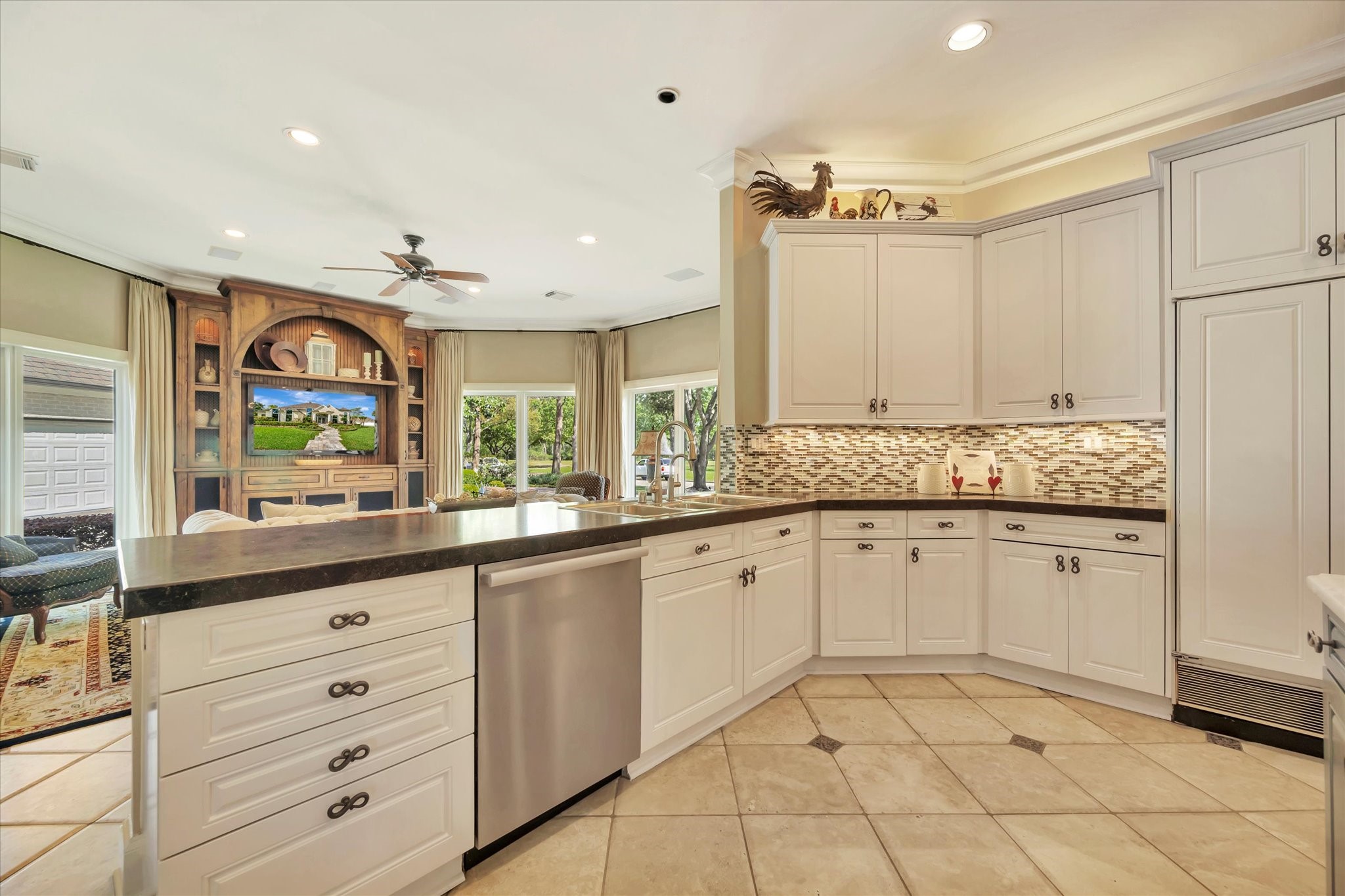 14214 Golf View Trail Houston, TX 77059 - Photo 39 of 49 a large kitchen with granite countertop white cabinets and a sink