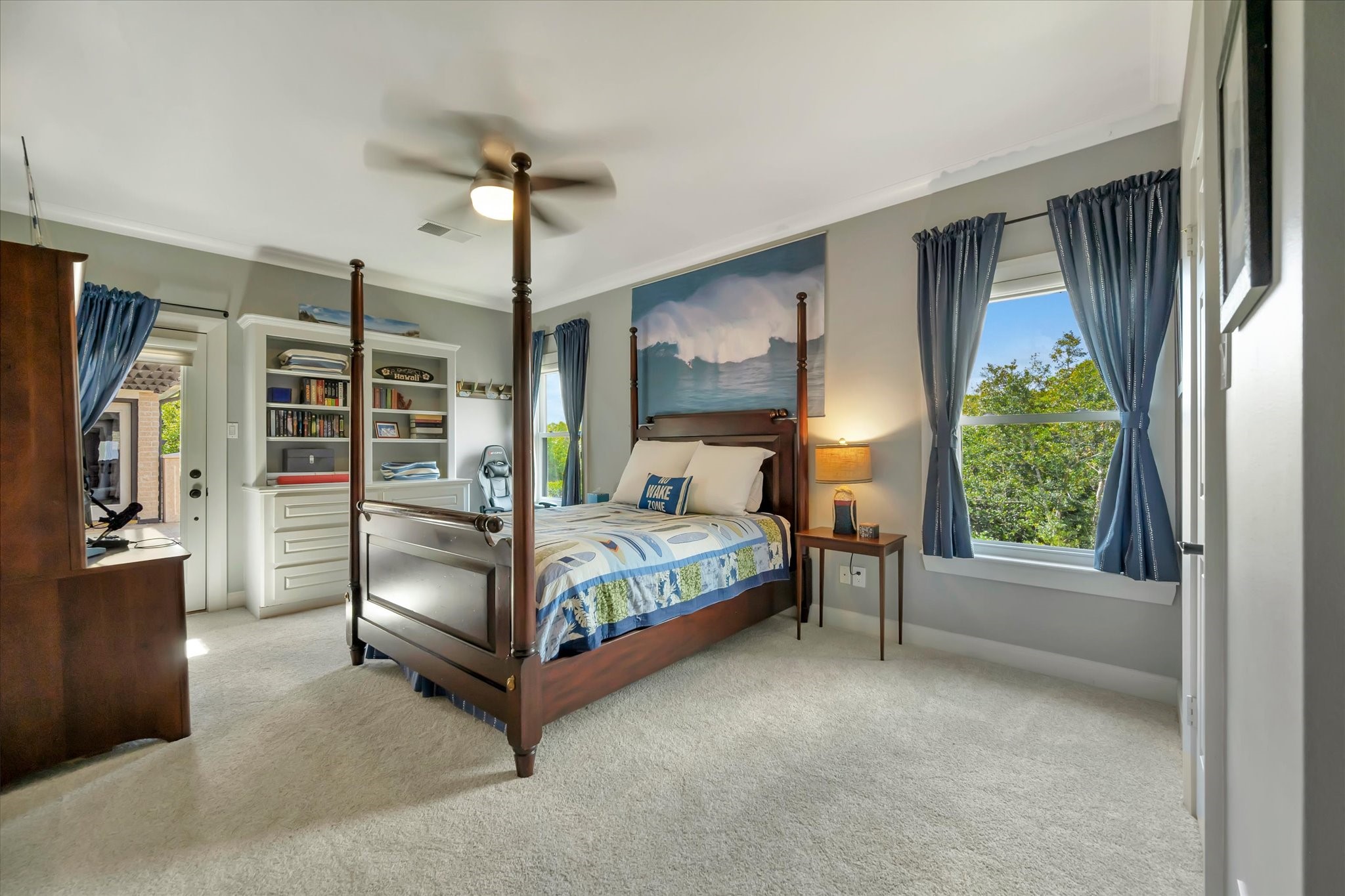 14214 Golf View Trail Houston, TX 77059 - Photo 42 of 49 a bedroom with a large bed and a chandelier