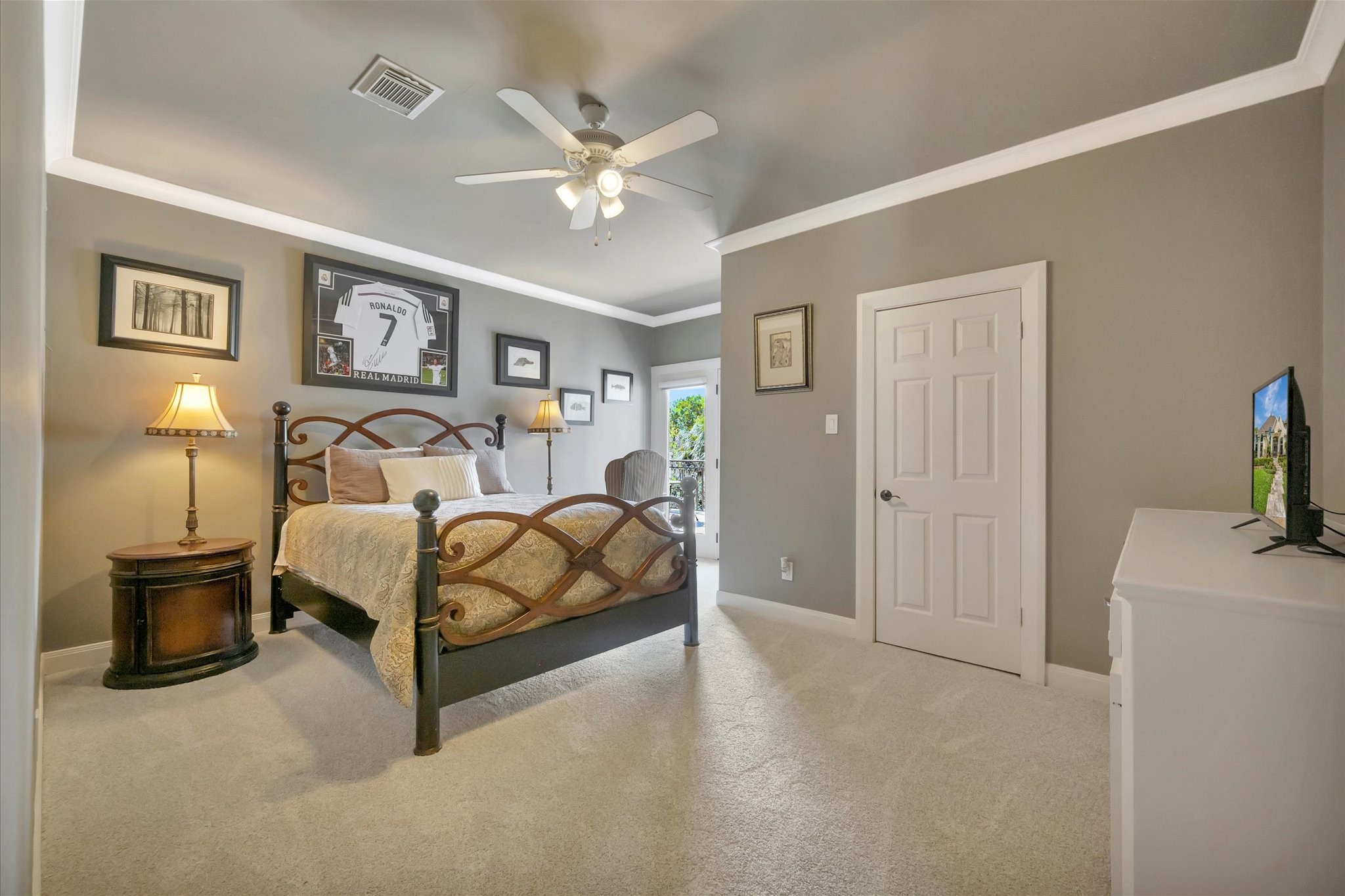 14214 Golf View Trail Houston, TX 77059 - Photo 43 of 49 a bedroom with a bed and a chandelier