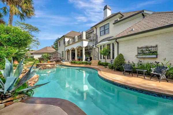 a view of a house with swimming pool