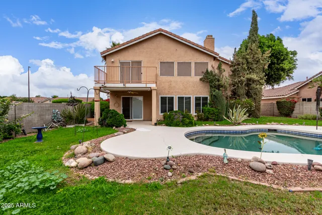 a view of a house with a yard porch and sitting area