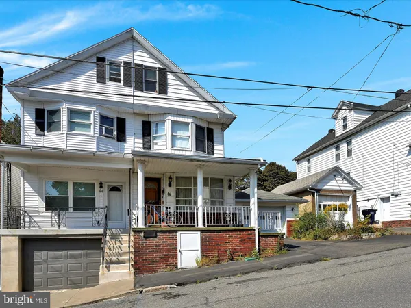front view of a house with a street