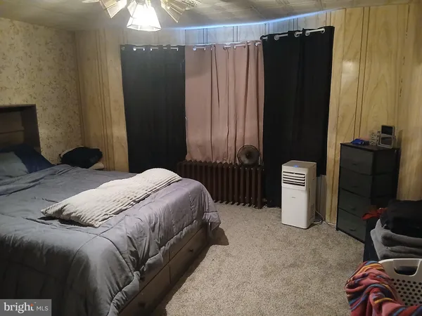 a bedroom with a bed and a closet