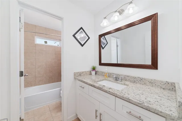 a bedroom with a bed and a lamp