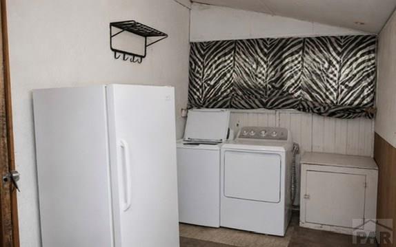 11229 County Rd JJ 5 Manzanola, CO 81058 - Photo 31 of 32 a utility room with dryer and washer