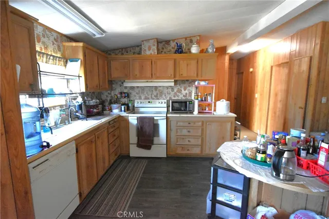 a kitchen with sink cabinets and window