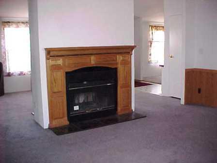14741 Douglas Road Yakima, WA 98908 - Photo 6 of 18 a living room with a fireplace in it