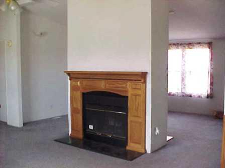 14741 Douglas Road Yakima, WA 98908 - Photo 10 of 18 a room with a fireplace and a window