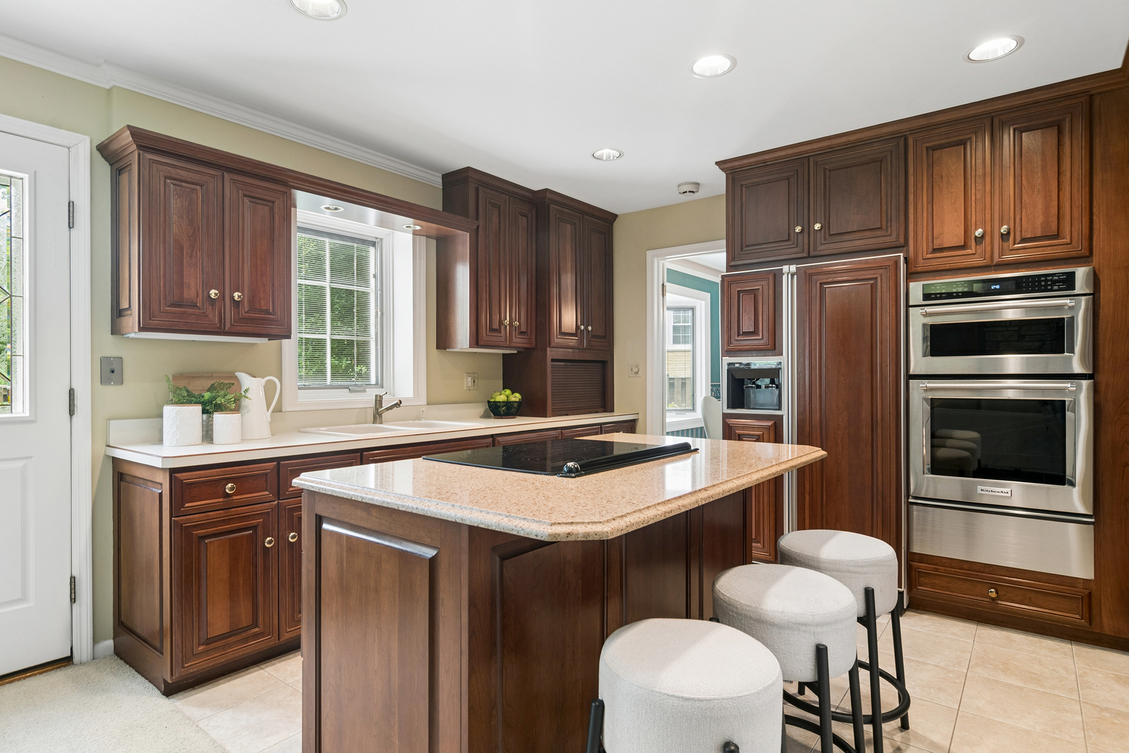572 East Monterey Road Palatine, IL 60074 - Photo 14 of 27 a kitchen with a sink refrigerator and cabinets