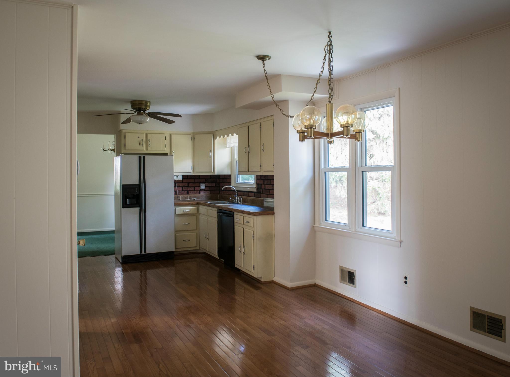 3213 Llewellyn Field Road Olney, MD 20832 - Photo 20 of 30 a kitchen with stainless steel appliances a refrigerator sink and cabinets