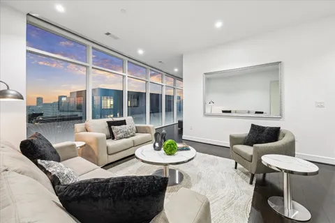 a view of a living room and dining room