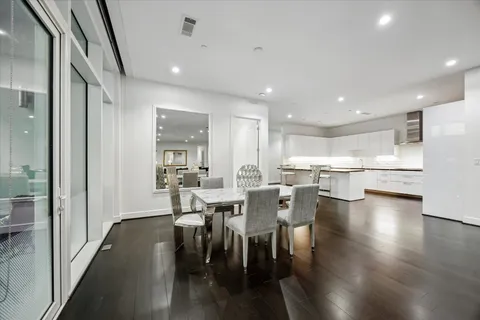 a view of a dining area with furniture and wooden floor