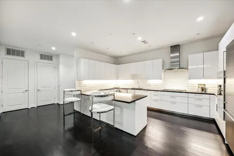 a kitchen with stainless steel appliances granite countertop a stove and a sink