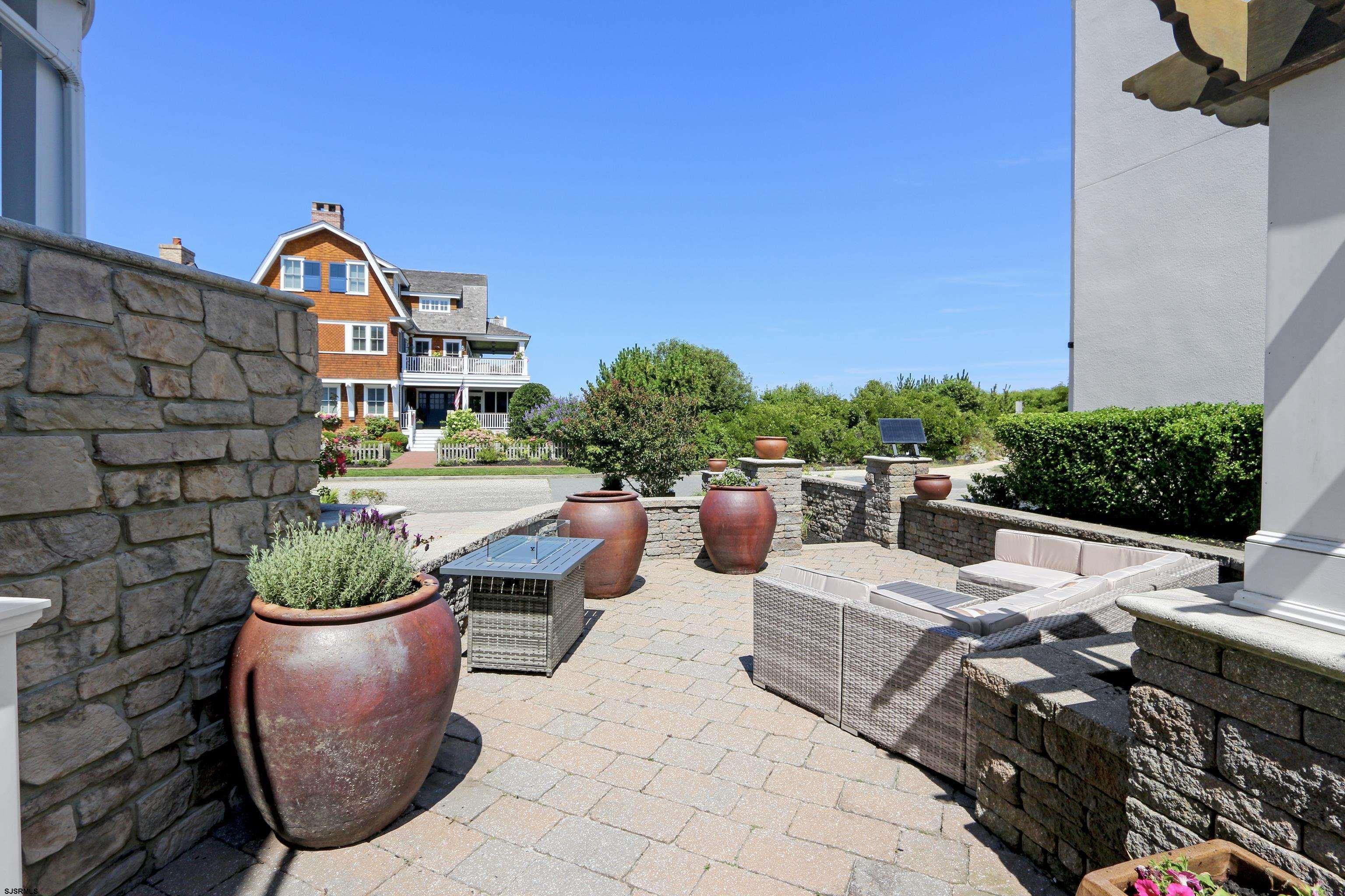 402 20th Street South Brigantine, NJ 08203 - Photo 11 of 59 a view of a chairs and table in a patio