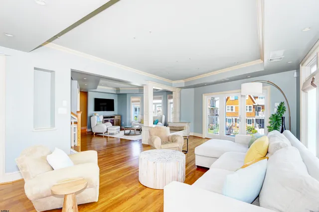 a view of a chairs and table in the roof deck