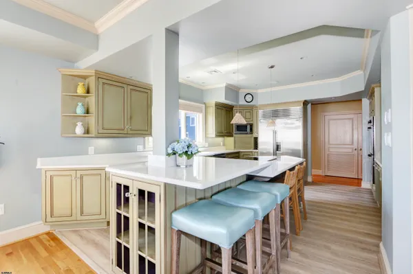 a kitchen with counter top space sink and center island