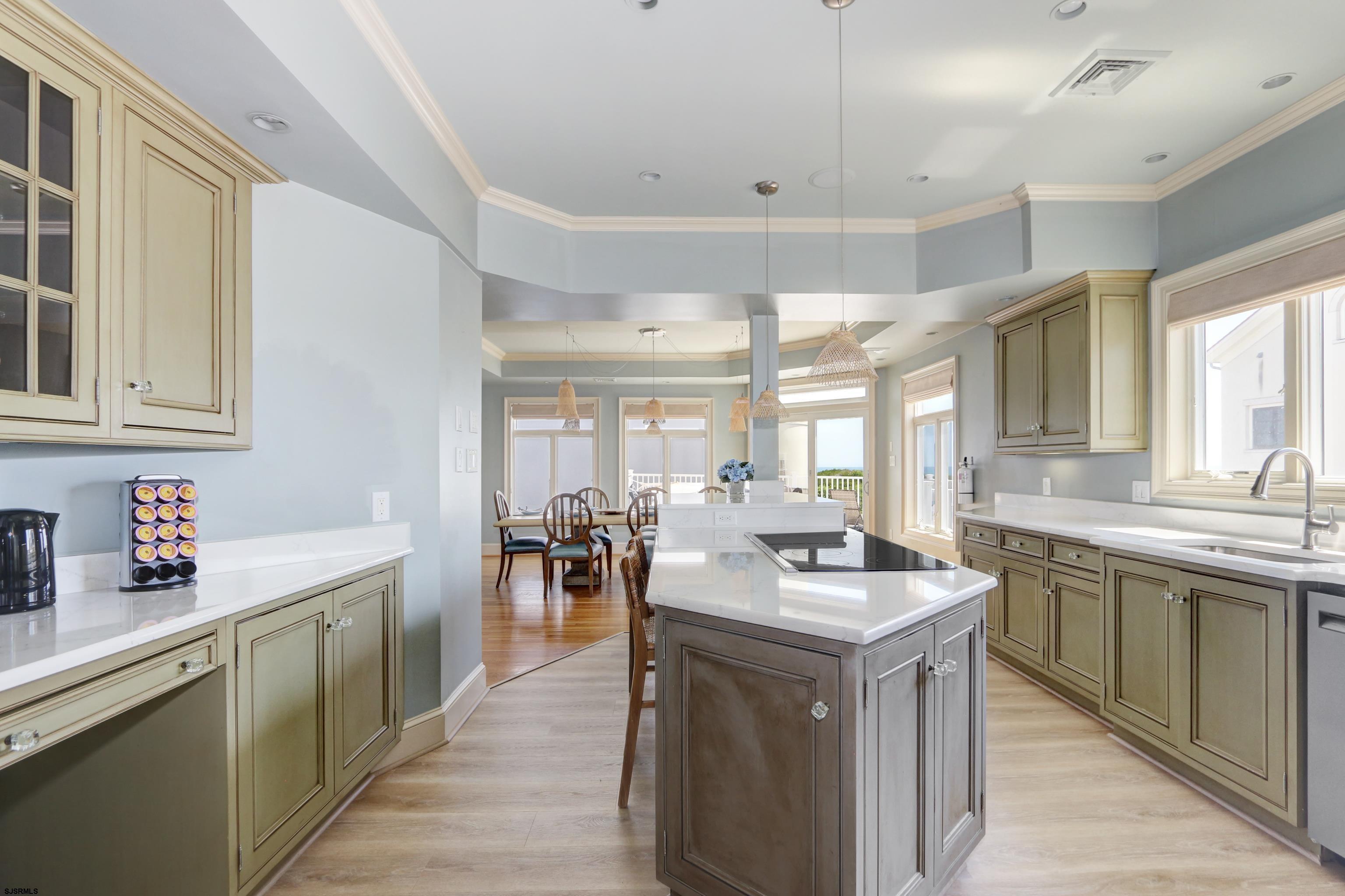 402 20th Street South Brigantine, NJ 08203 - Photo 23 of 59 a kitchen with counter top space sink and center island