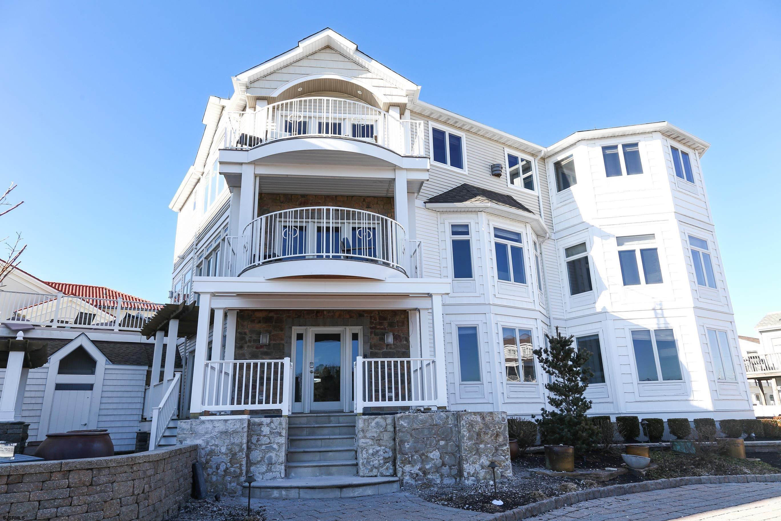 402 20th Street South Brigantine, NJ 08203 - Photo 30 of 59 a front view of a residential apartment building with a front door