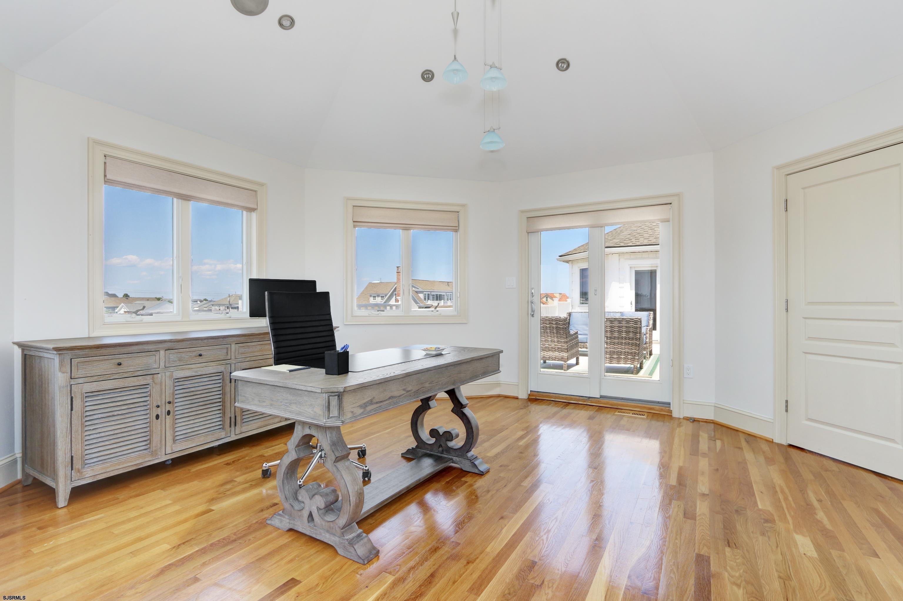 402 20th Street South Brigantine, NJ 08203 - Photo 33 of 59 a view of a workspace with furniture and a window