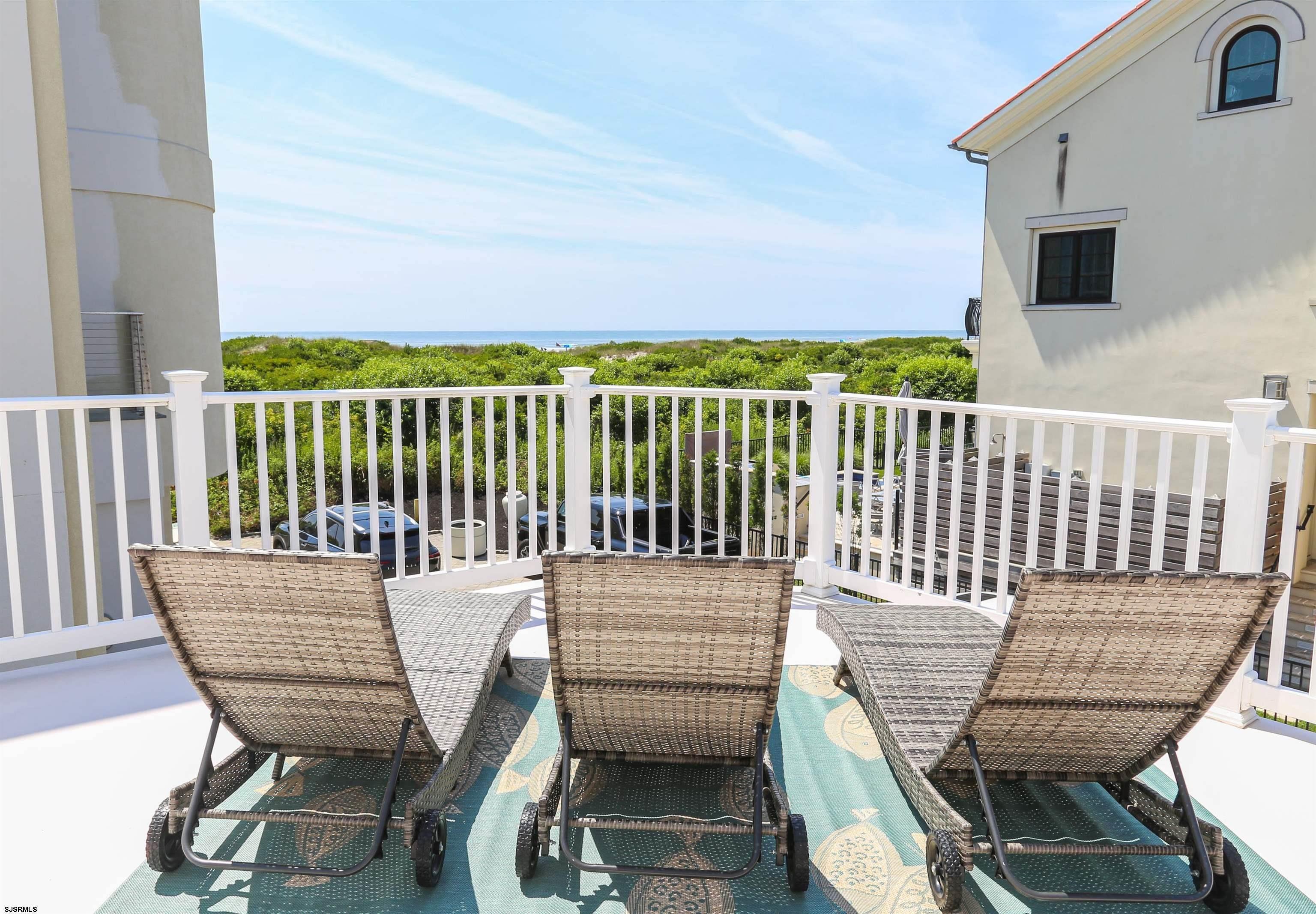 402 20th Street South Brigantine, NJ 08203 - Photo 37 of 59 a view of a chair in wooden deck