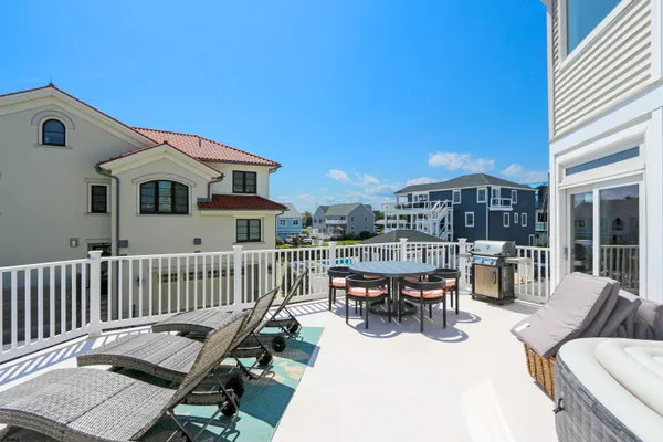 a spacious bedroom with a bed and large windows