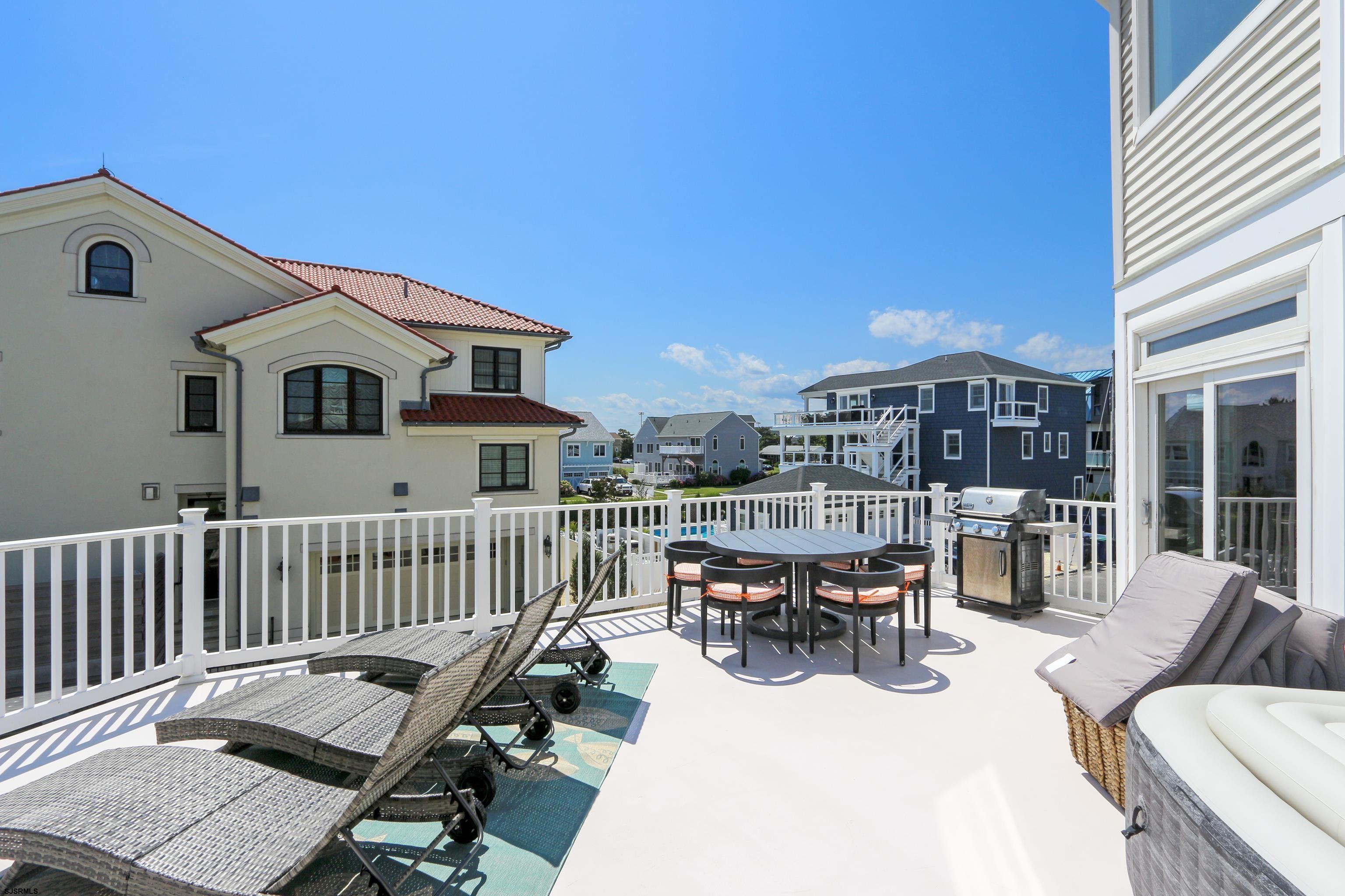 402 20th Street South Brigantine, NJ 08203 - Photo 38 of 59 a view of a patio with a table and chairs