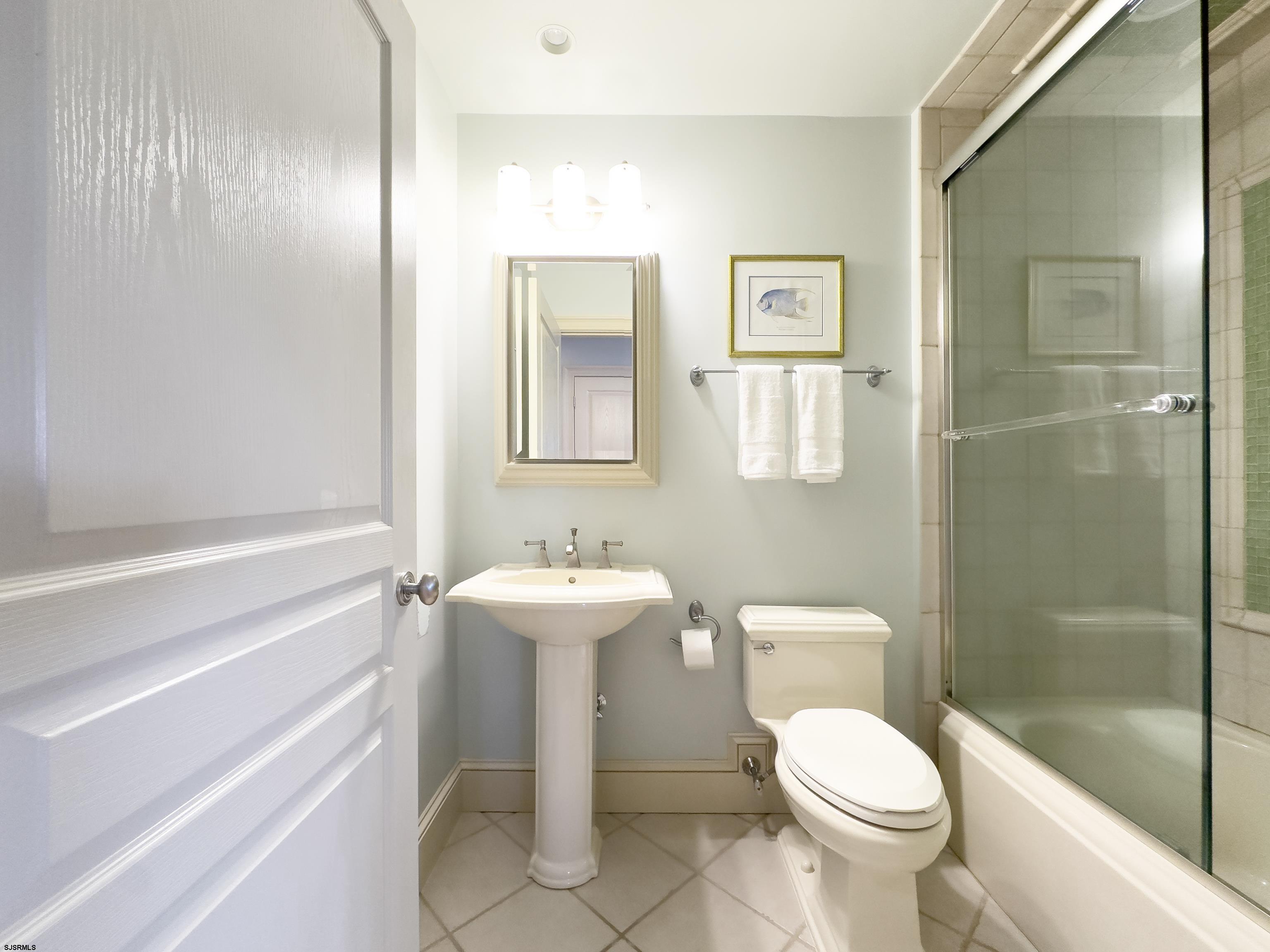 402 20th Street South Brigantine, NJ 08203 - Photo 46 of 59 a bathroom with a toilet sink and shower