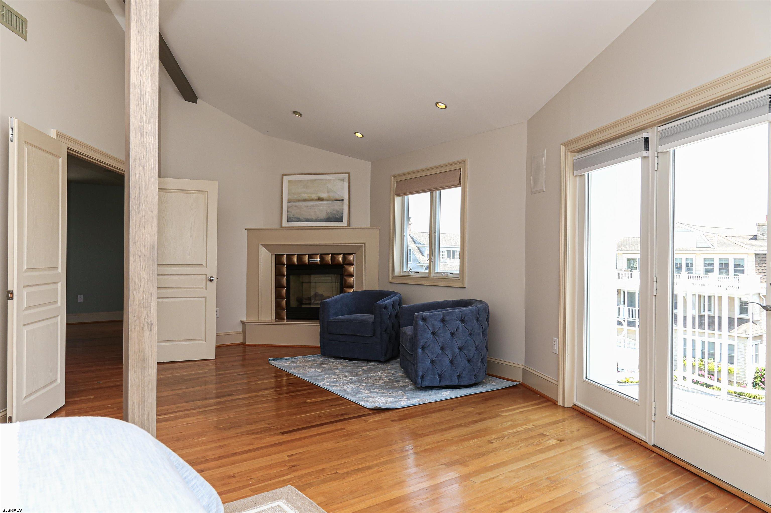 402 20th Street South Brigantine, NJ 08203 - Photo 6 of 59 a living room with furniture and a fireplace