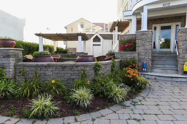 a view of a patio with couches and potted plants