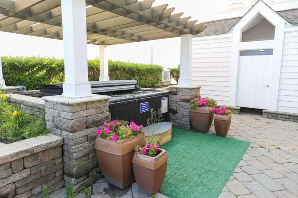 a view of a chairs and table in a patio